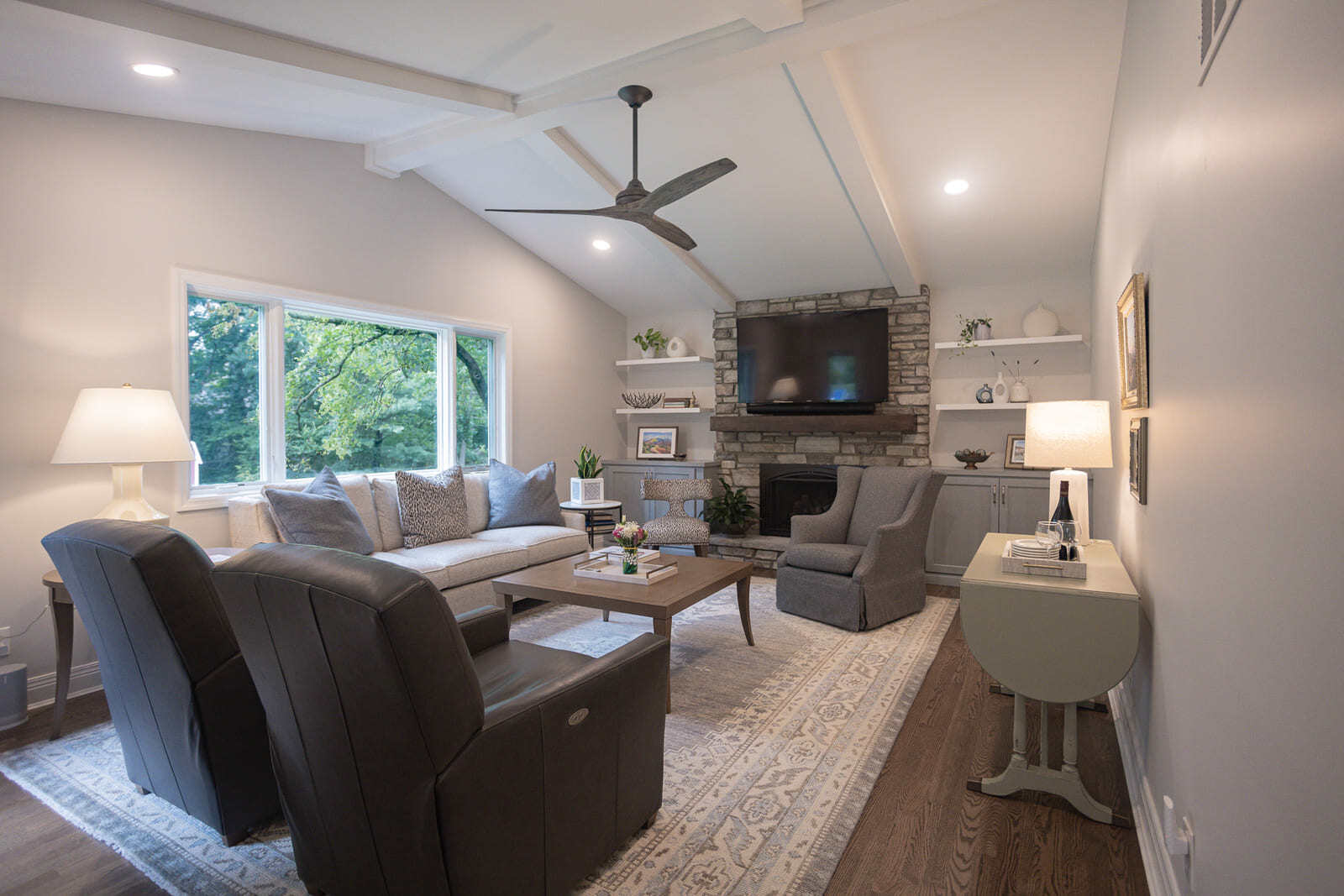 Family room remodel in Cincinnati with stone fireplace by Legacy Builders