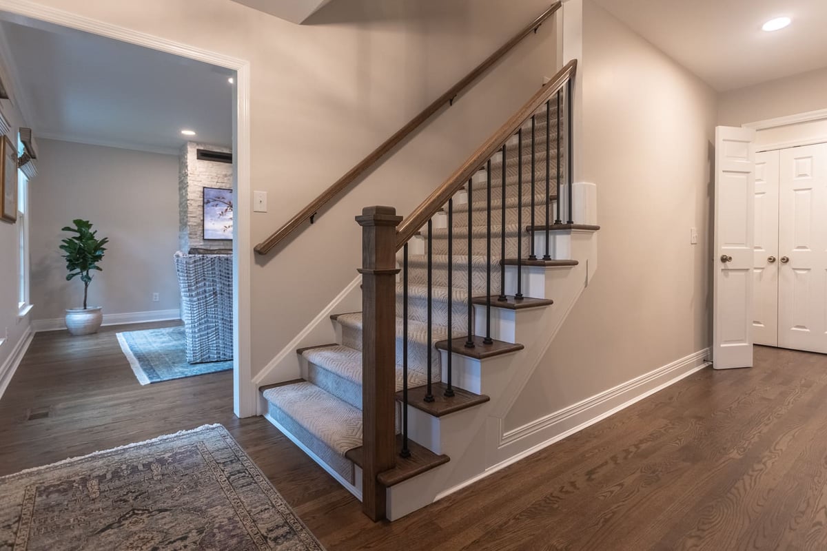 Foyer staircase with new railing and posts by Legacy Builders Group in Cincinnati, OH