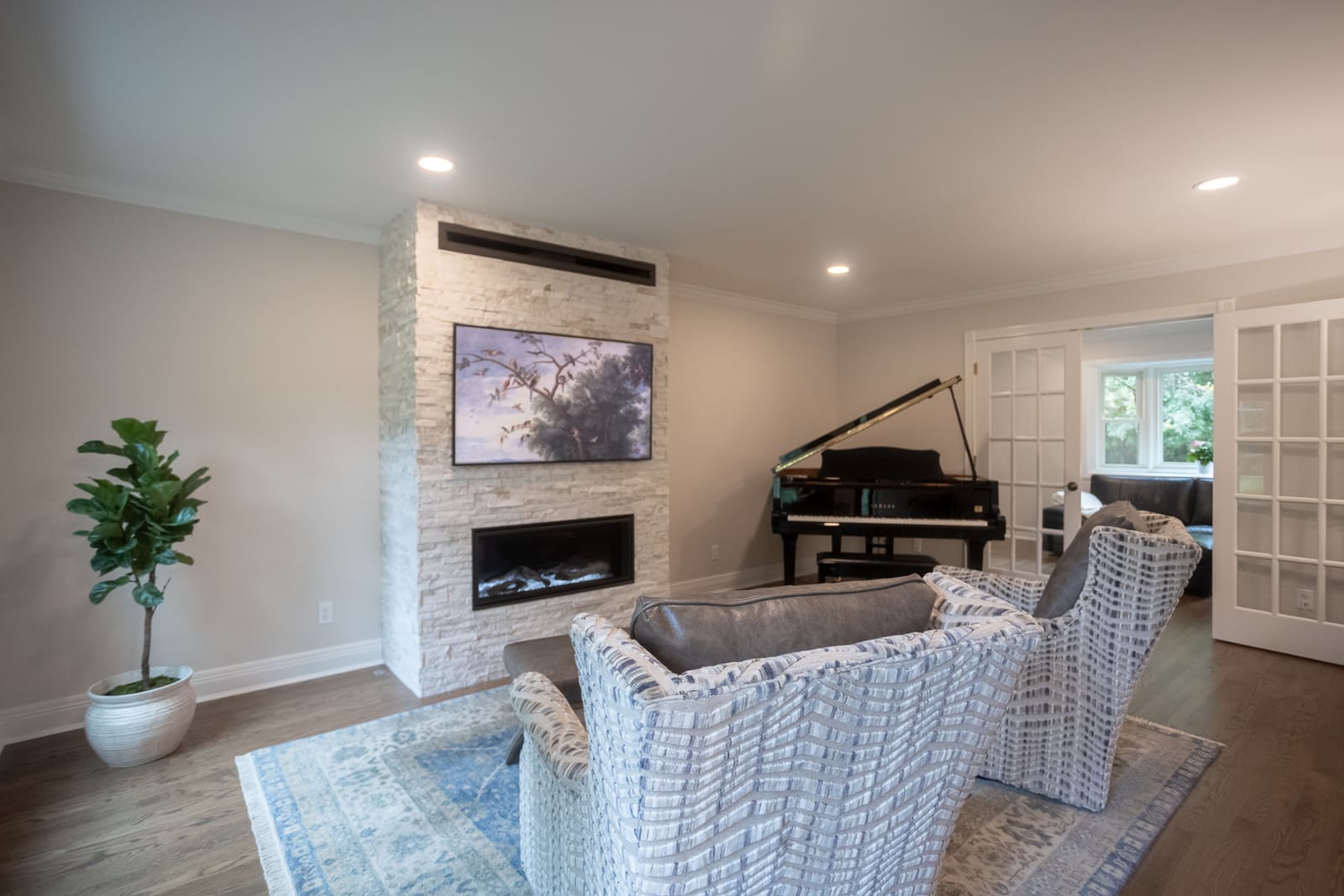 Front living room remodel in Cincinnati with stone fireplace by Legacy Builders