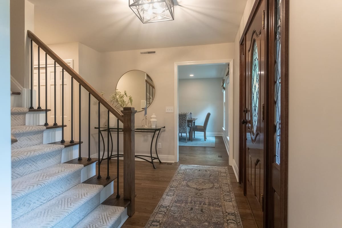 Red oak hardwood flooring in foyer of Cincinnati home remodel by Legacy Builders