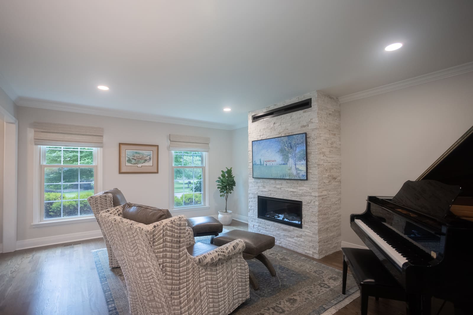 Front living room remodel in Cincinnati with stone fireplace by Legacy Builders