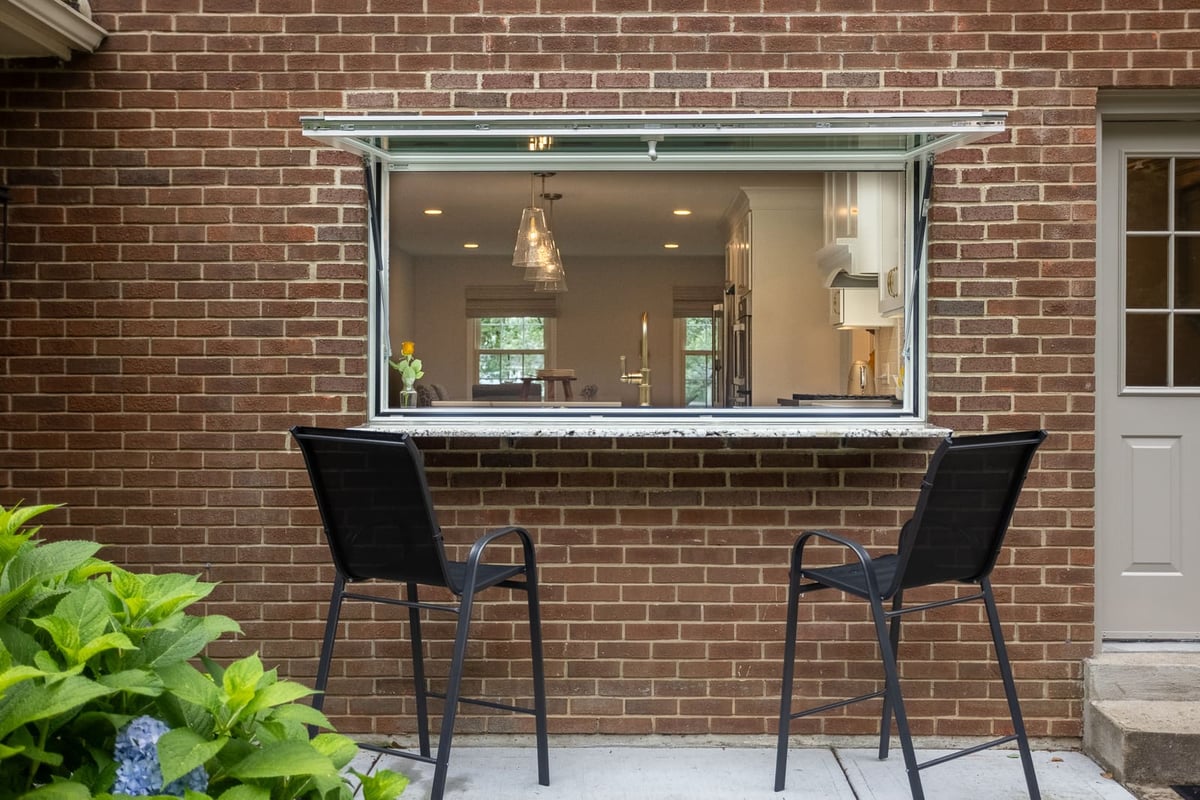 Exterior view of pass-through awning window in remodel by Legacy Builders