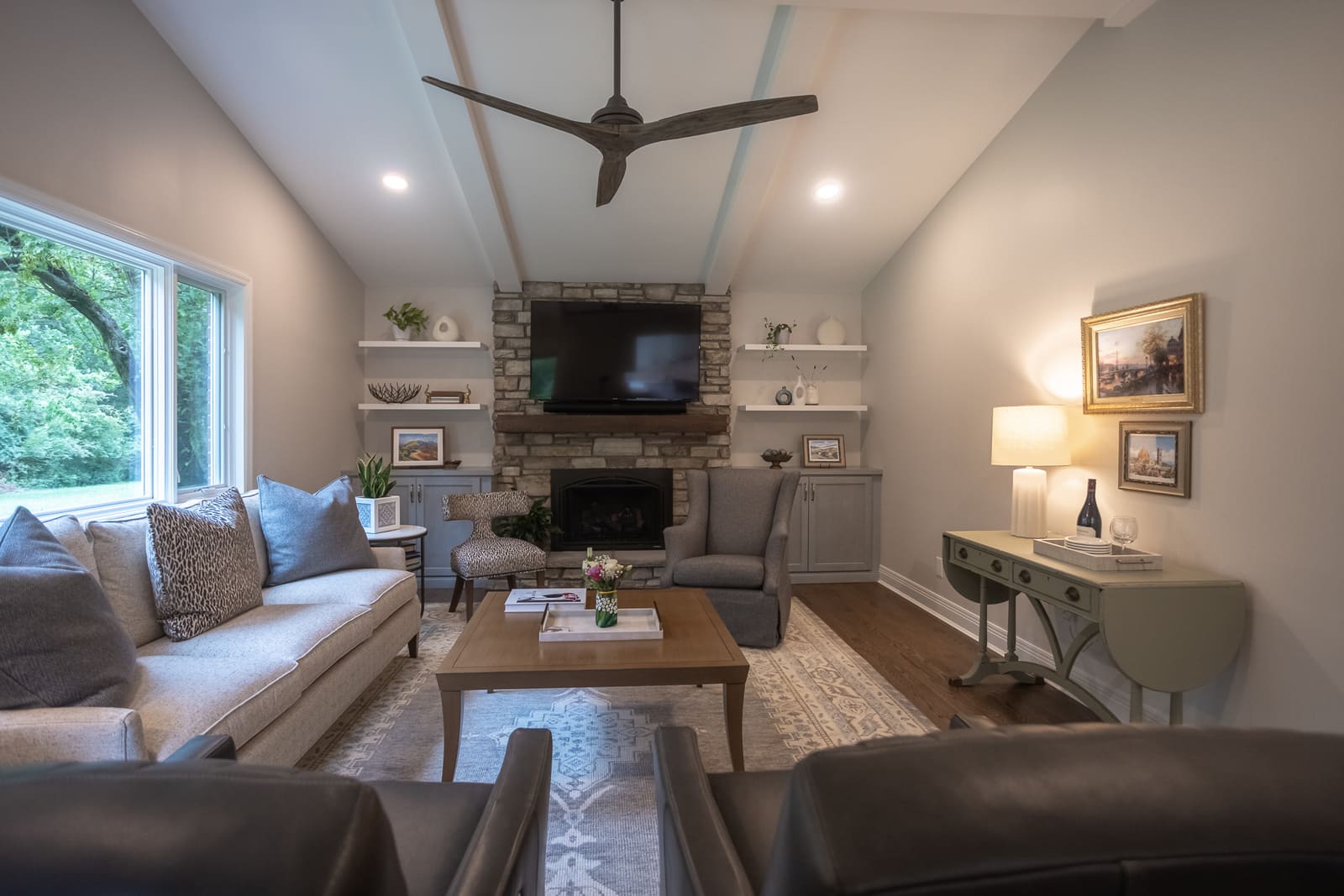 Family room remodel in Cincinnati with stone fireplace by Legacy Builders