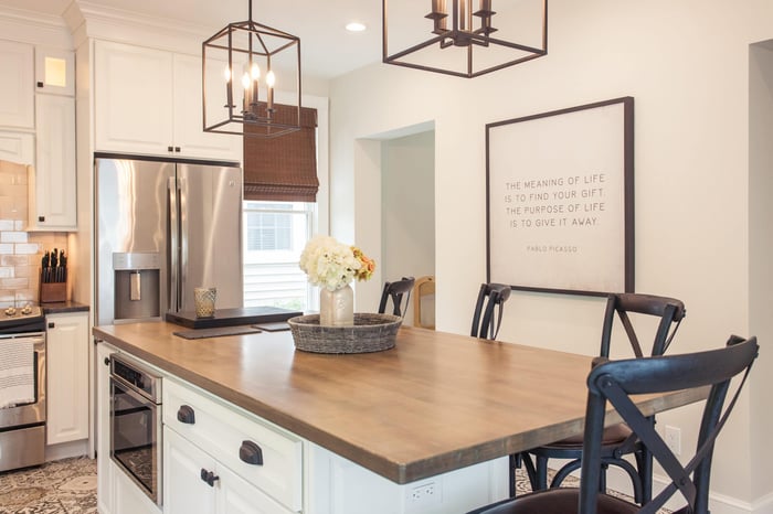 Island in Cincinnati kitchen remodel with microwave and seating by Legacy Builders