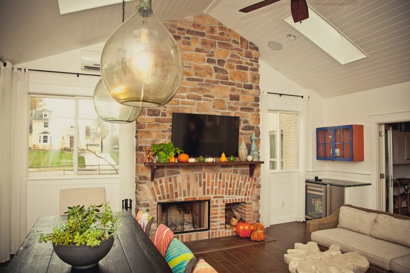 Montgomery, OH home addition with skylights on vaulted ceiling with brick fireplace by Legacy Builders