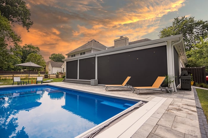 Pool and patio by Legacy Builders in Cincinnati at sunset