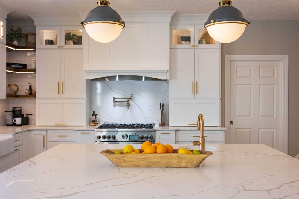 Modern white kitchen remodel with slab backsplash and chrome fixtures