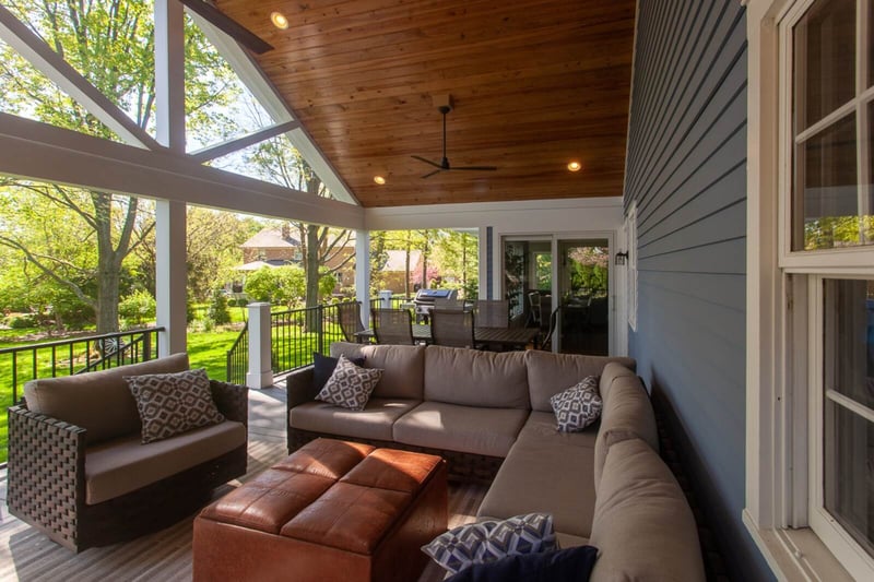 Outdoor furniture on covered porch in Cincinnati by Legacy Builders Group