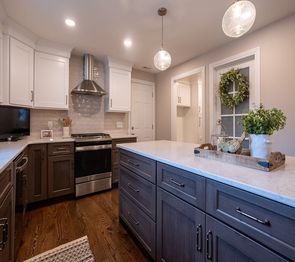 Double pendulum lights above island in White Oak, OH kitchen remodel by Legacy Builders