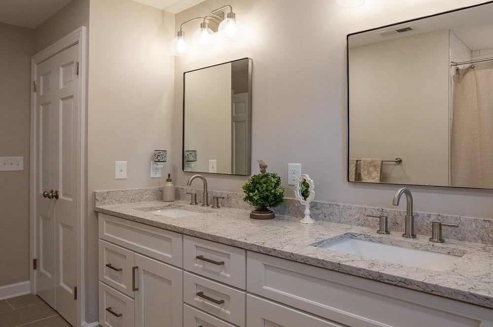 Double vanity in hall bathroom remodel in White Oak, OH with water closet layout