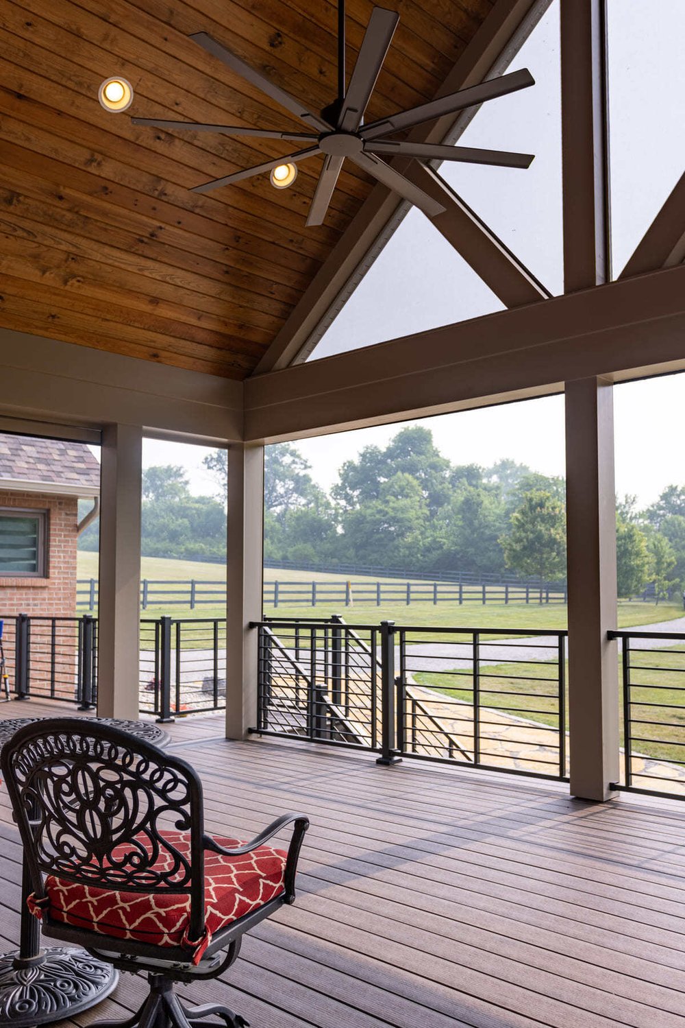 Aluminum railing on covered deck in Cincinnati, OH outdoor living space by Legacy Builders