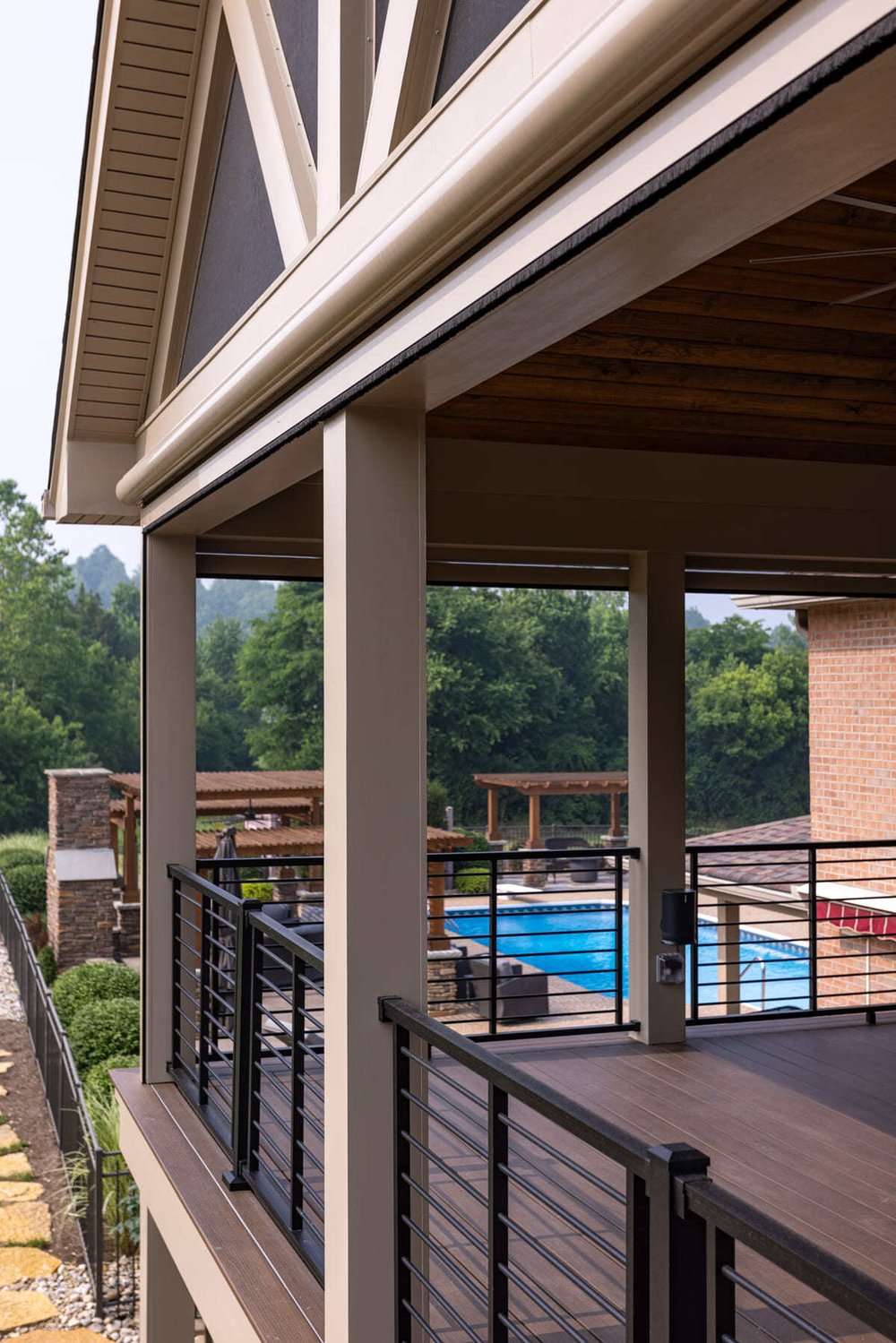 Covered deck with faux gable roof in Cincinnati, OH by Legacy Builders