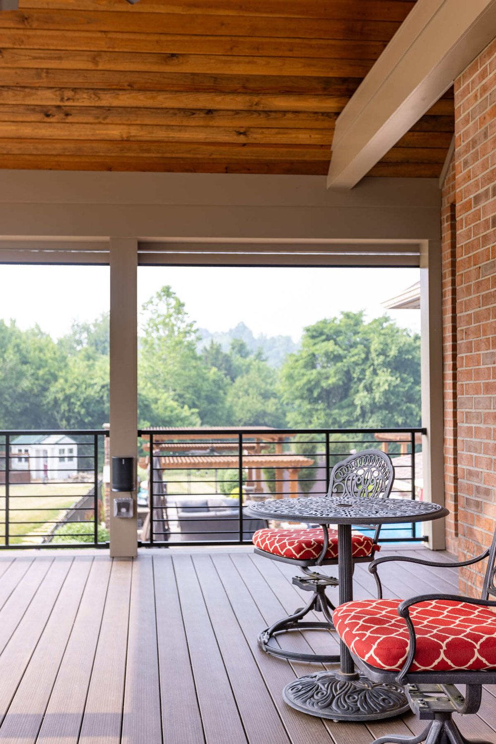 View of covered deck in Cincinnati outdoor living space with composite decking material by Legacy Builders